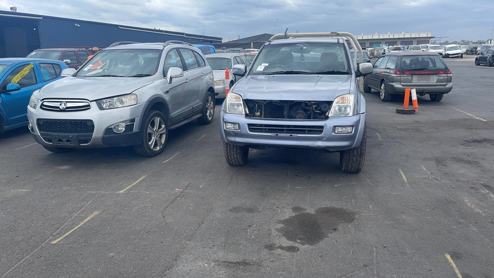 Sell My Scrap Car Macleod VIC 1 Two vehicles parked among cars in a vehicle yard