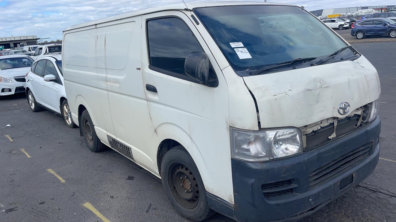 White van parked alongside other vehicles