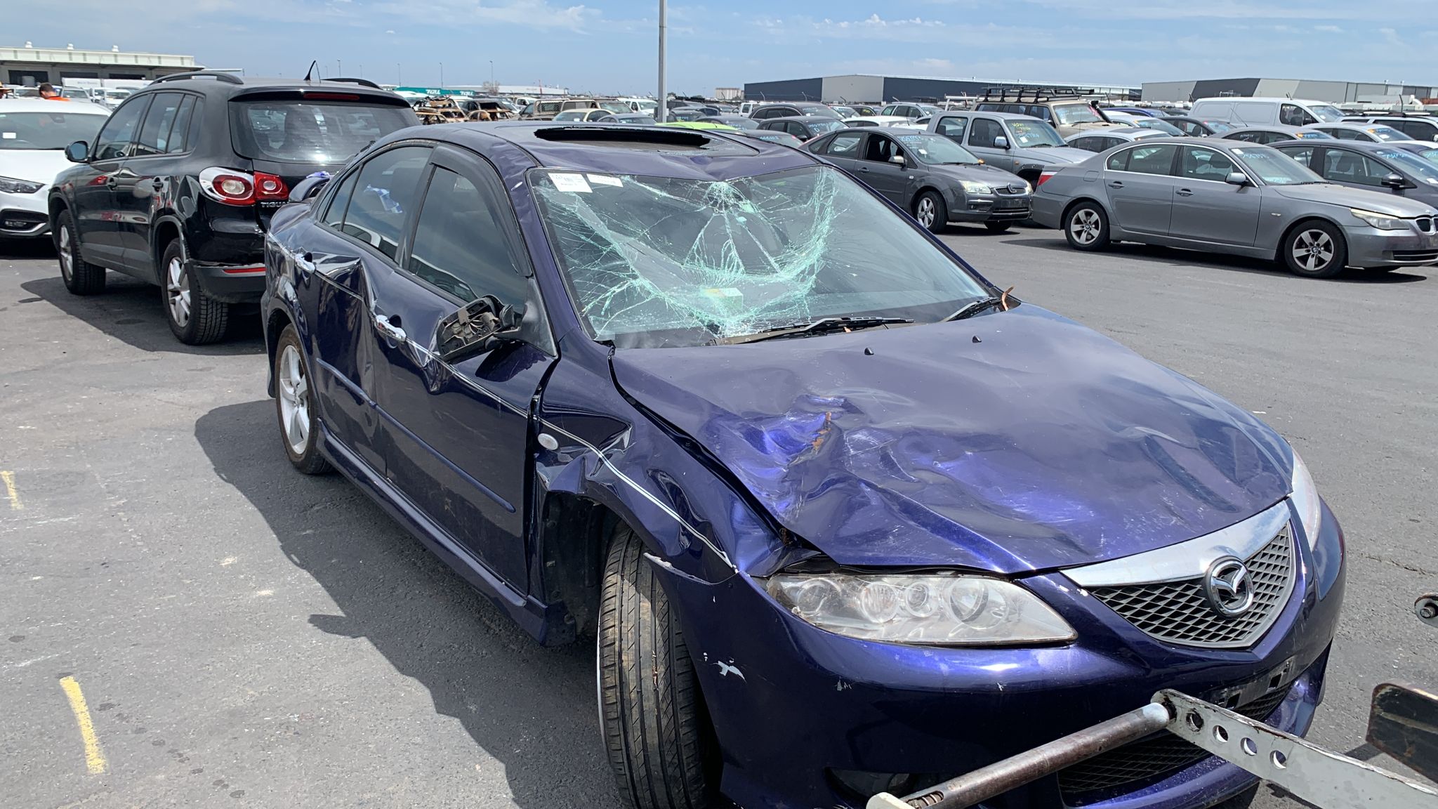 Sell My Scrap Car Pascoe Vale VIC 1 Purple hatchback with accident damage in a vehicle yard