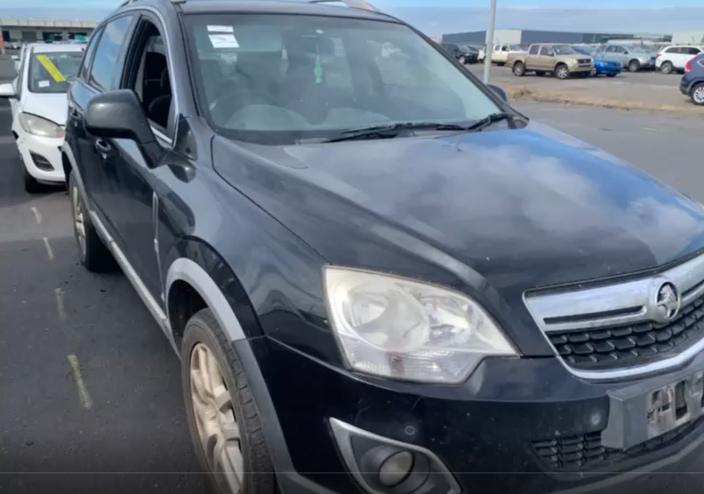 Sell My Scrap Car Skye VIC 1 Dark hatchback parked in a vehicle yard