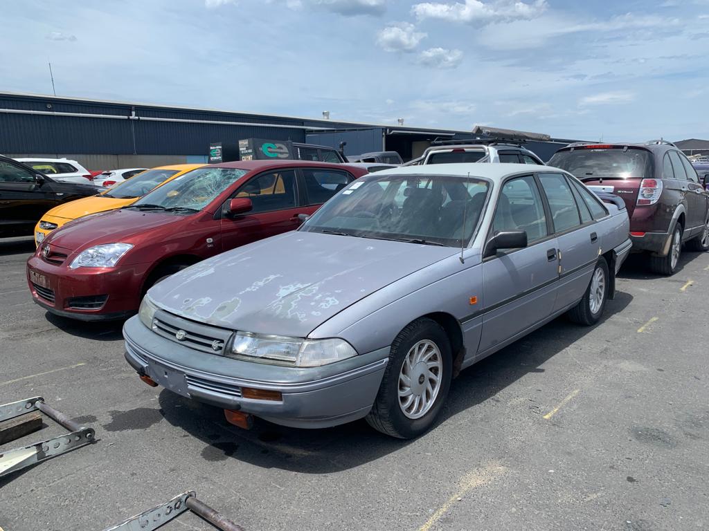 Sell My Scrap Car Aintree VIC 1 Silver sedan parked among vehicles