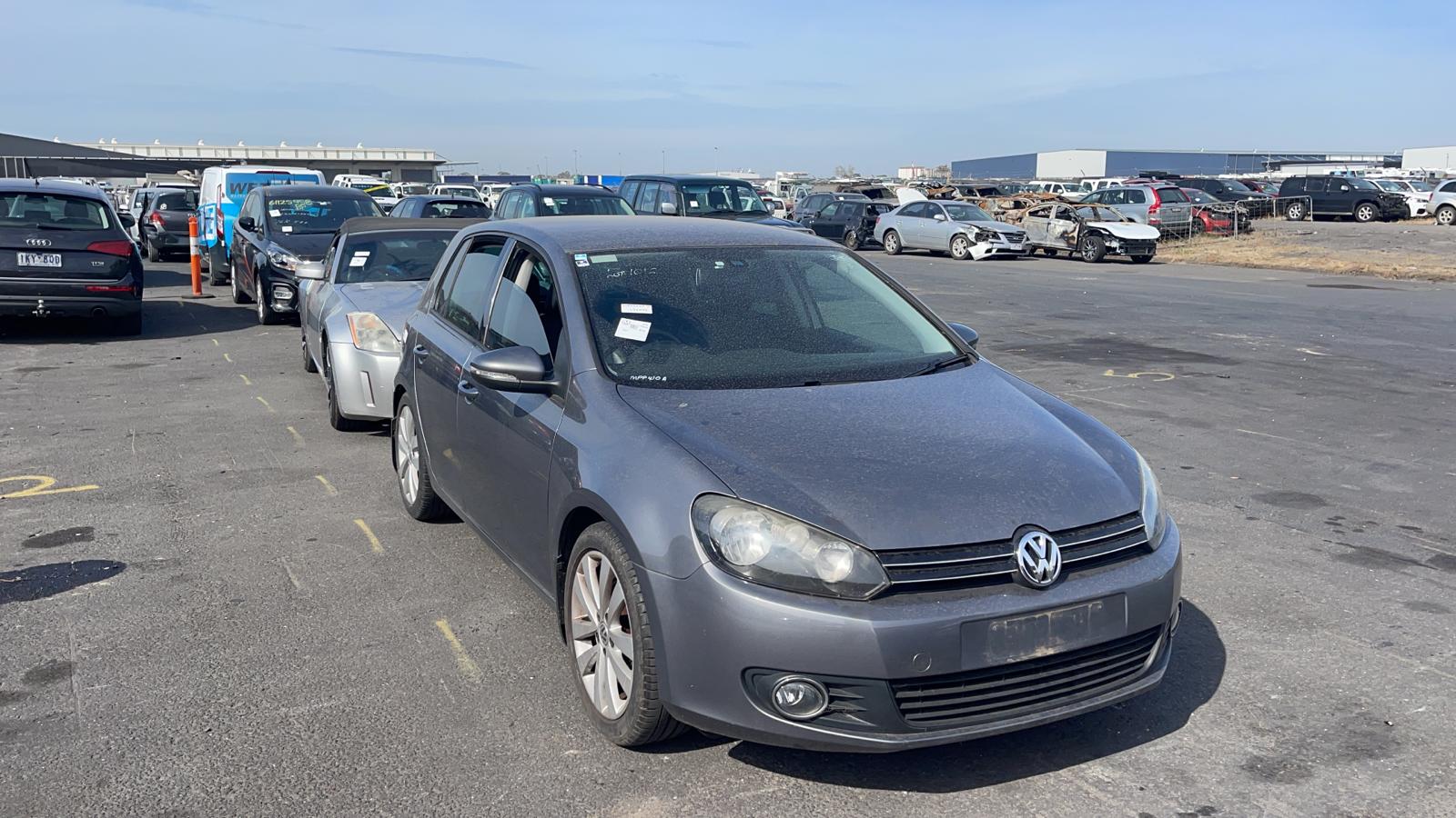 Sell My Scrap Car Iona VIC 1 Grey hatchback in a vehicle yard