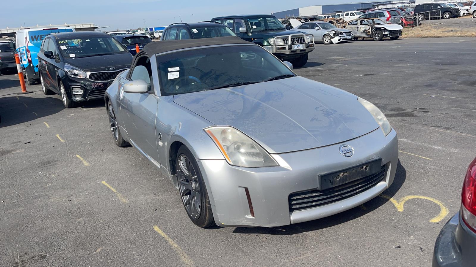 Silver sports coupe with front damage