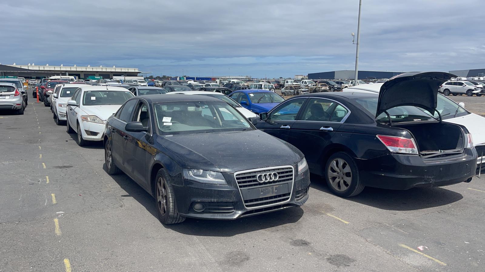 Sell My Scrap Car Warrandyte VIC 1 Dark sedan parked among vehicles