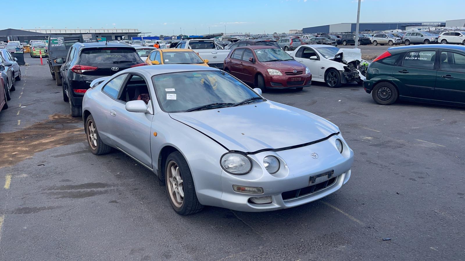 Sell My Scrap Car Diggers Rest VIC 1 Silver coupe in a vehicle yard