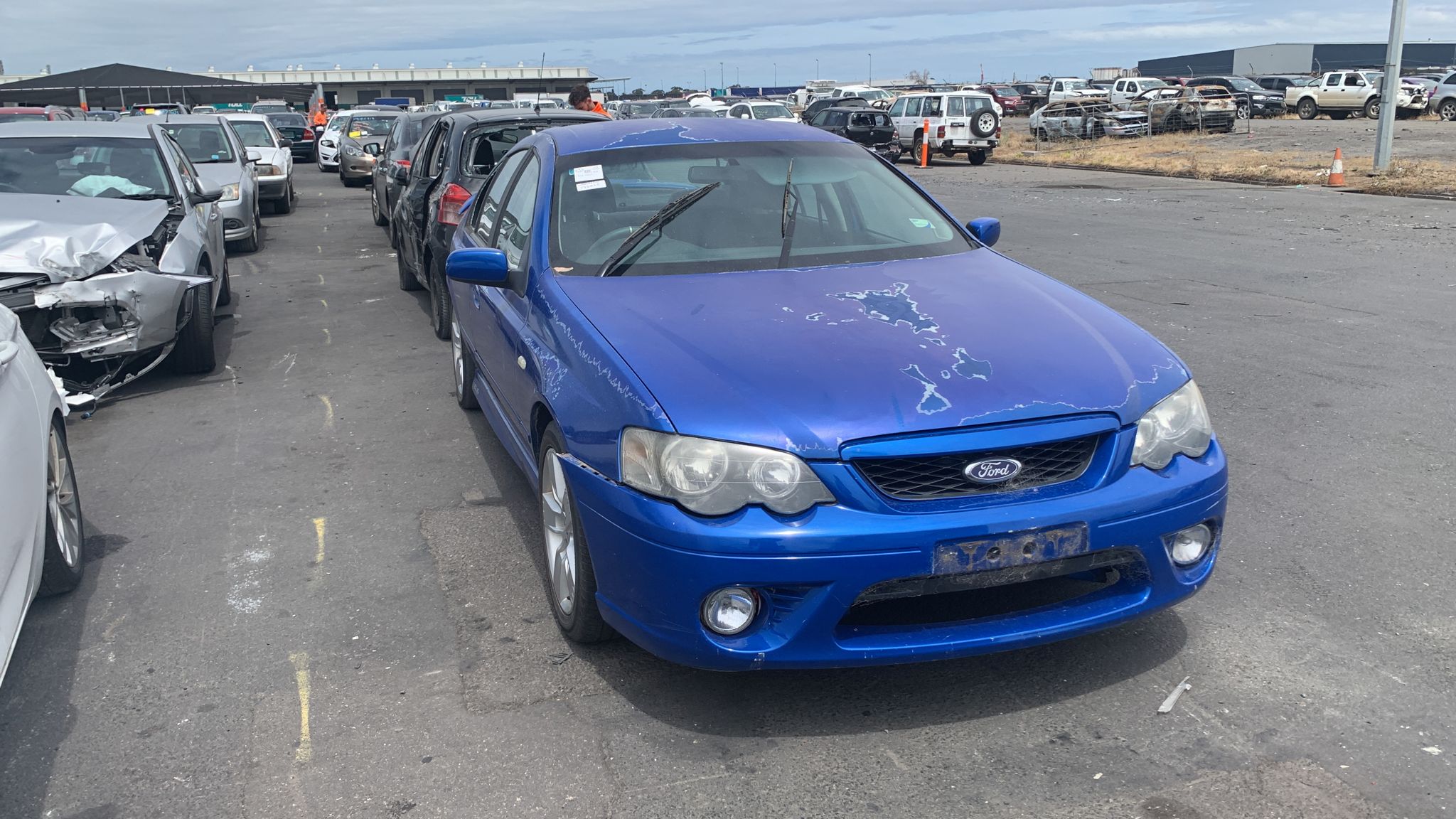 Sell My Scrap Car Tarneit VIC 1 Blue sedan parked in a vehicle yard