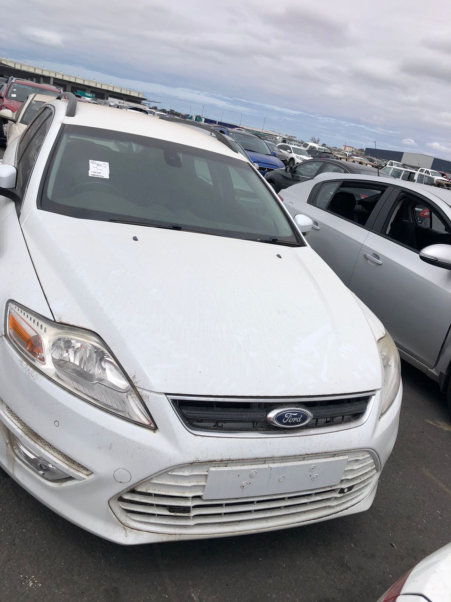 Sell My Scrap Car Tottenham VIC 1 White car parked in a vehicle yard