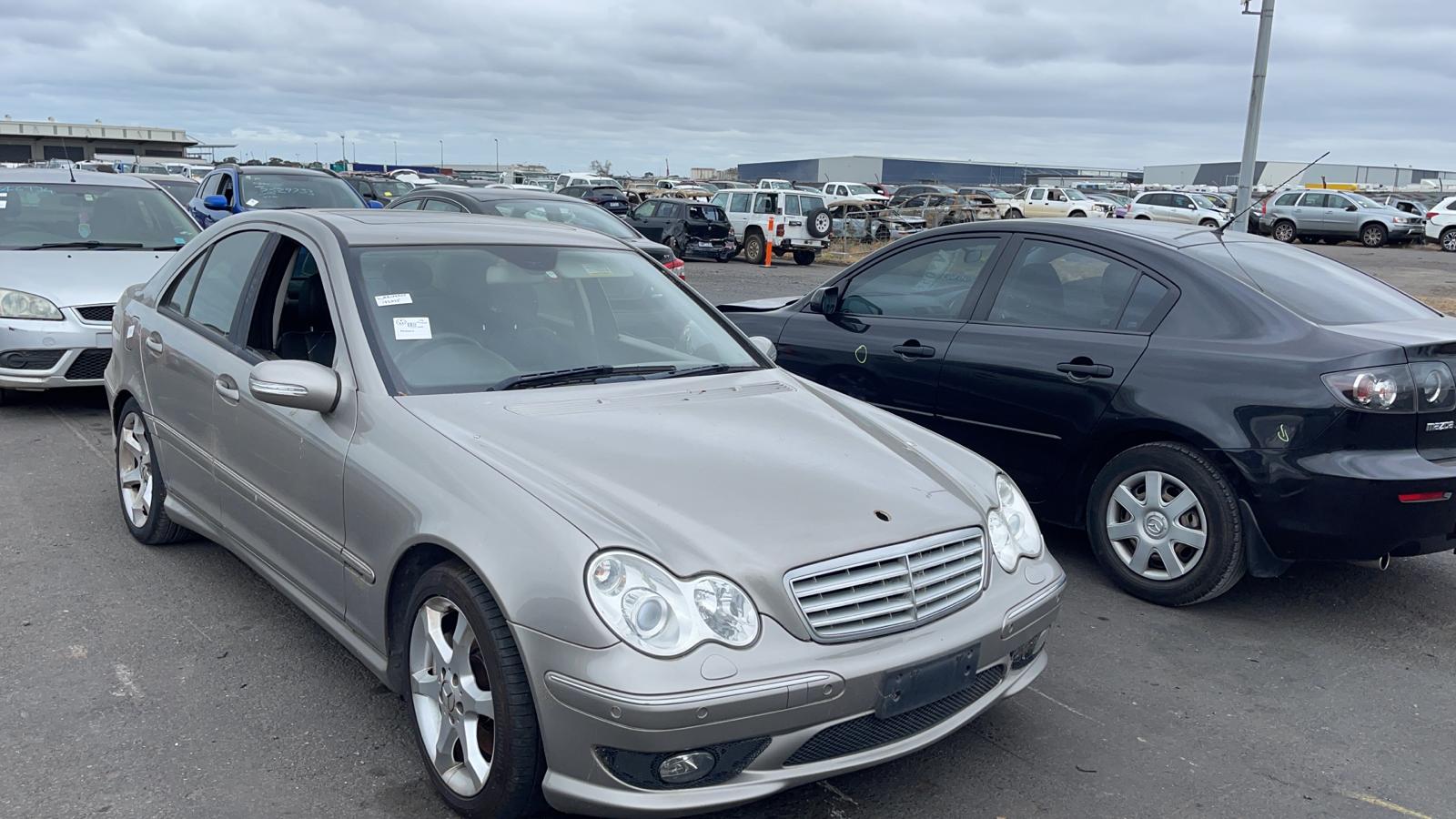 Sell My Scrap Car Essendon VIC 1 Silver sedan in a vehicle yard