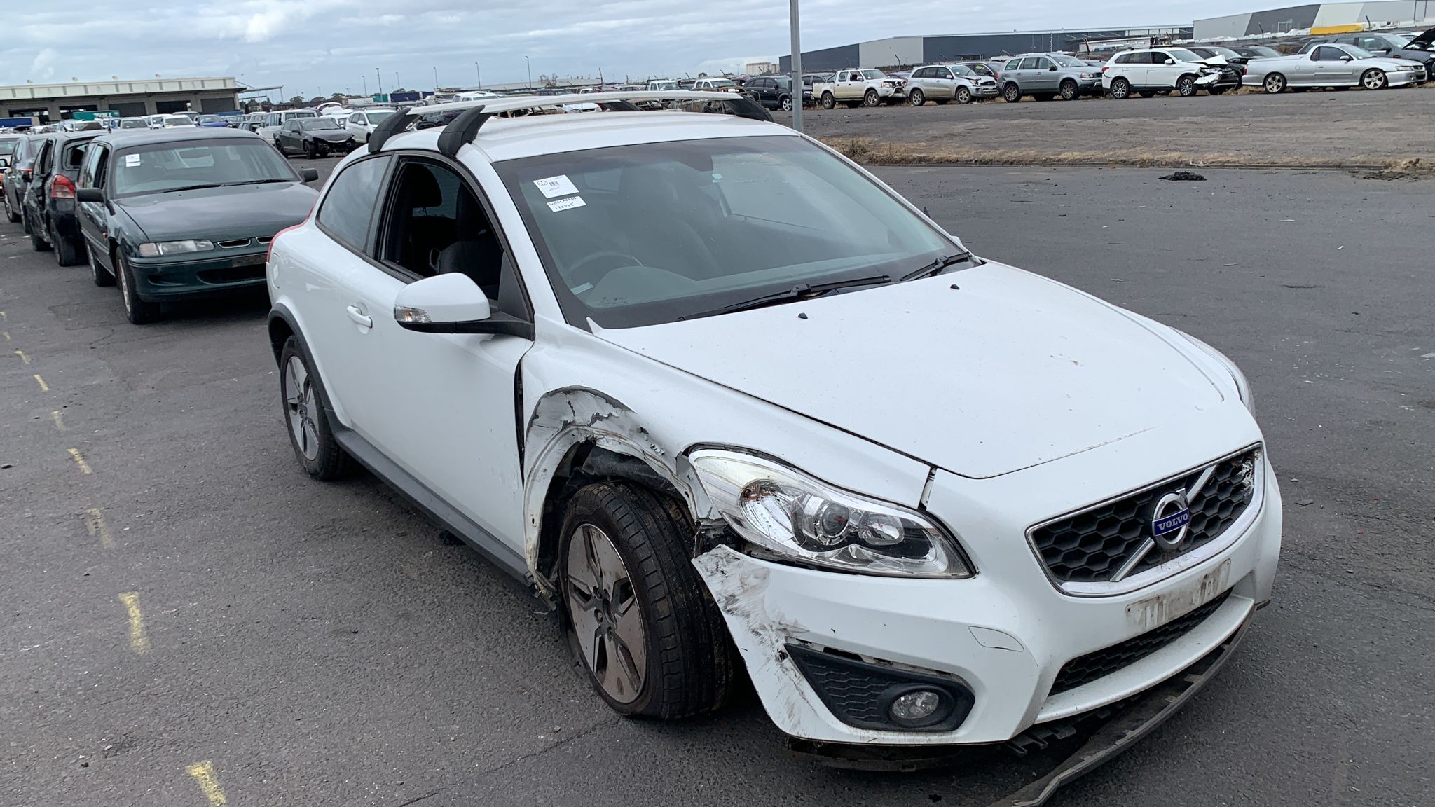 White wagon in a vehicle yard